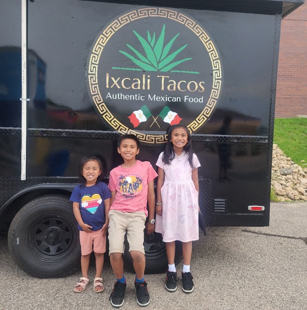 Kids in front of the truck